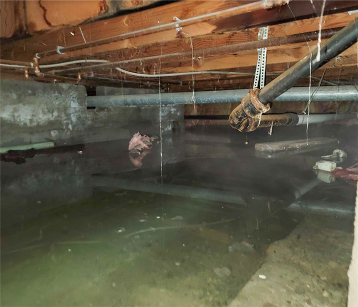 a flooded crawlspace under a house