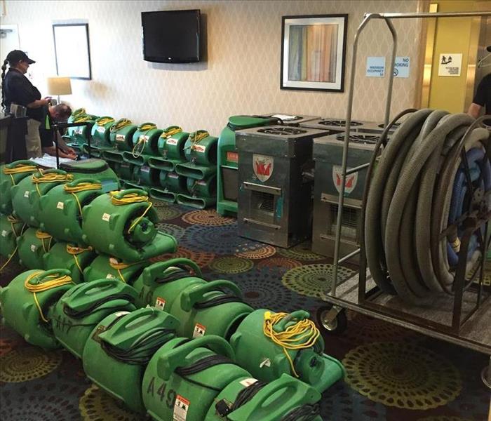 air movers and dehus stacked at site