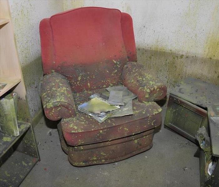 flood damaged room with recliner