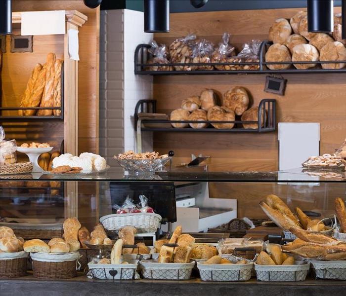 Bakery counter display case and breads on wall racks