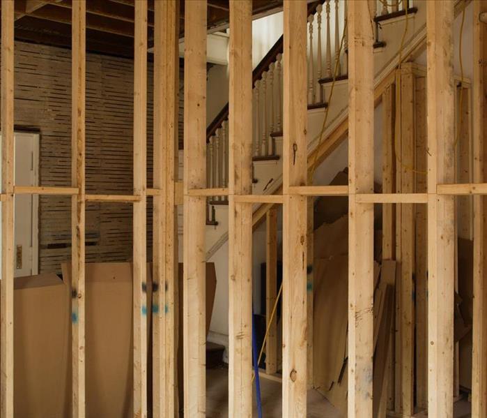 exposed wall showing new studs