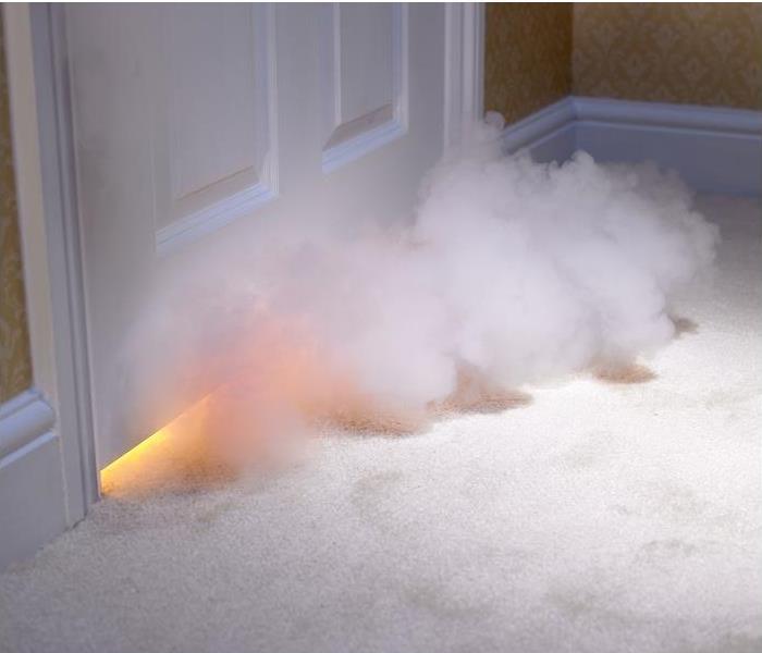smoke entering room under closed door; fire seen under door