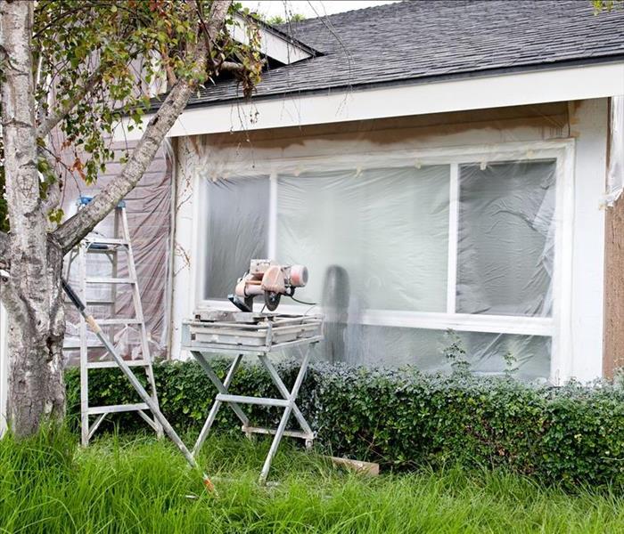 poly sheeting over exposed windows