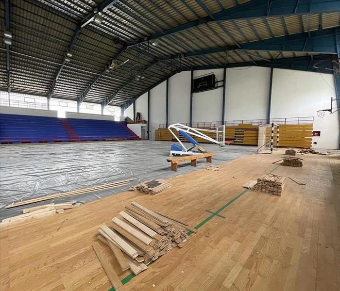 replacing hardwood flooring in a gym