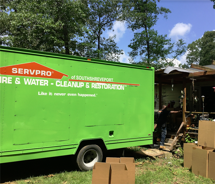 SERVPRO truck by a house it is working on